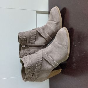 Light brown suede boots.